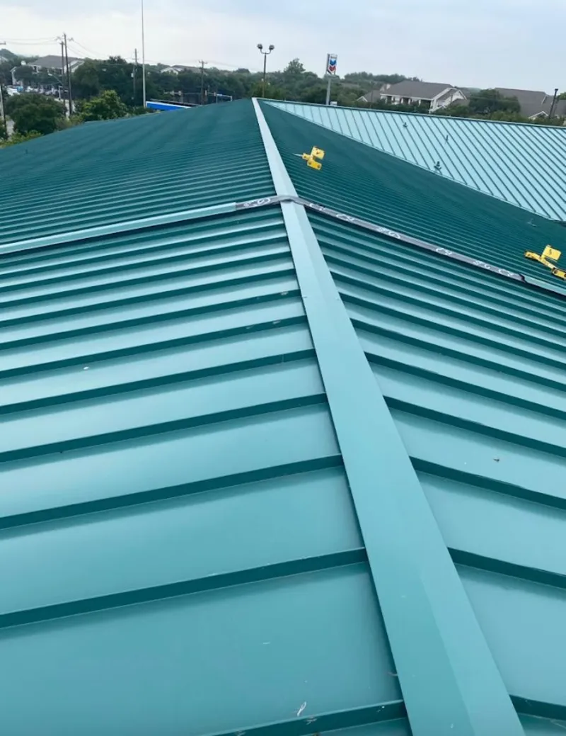 Green commercial metal roof ridge and valley for Metal Roof Repair in De Pere