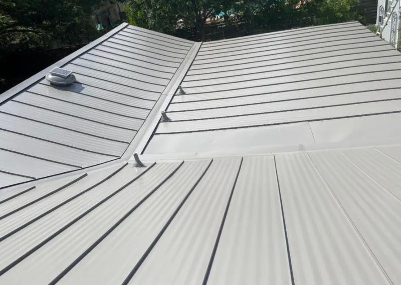 Solar attic fan installed on a metal roof for Roof Ventilation in De Pere